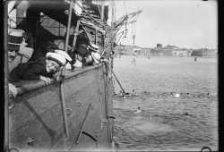 War orphaned children swim in the Venetian lagoon near the school ship "Scilla"